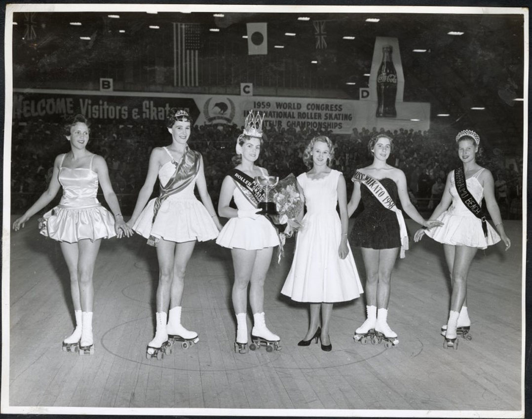 Black and white photograph of female skaters at a skating competition