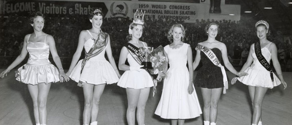 Black and white photograph of female skaters at a skating competition