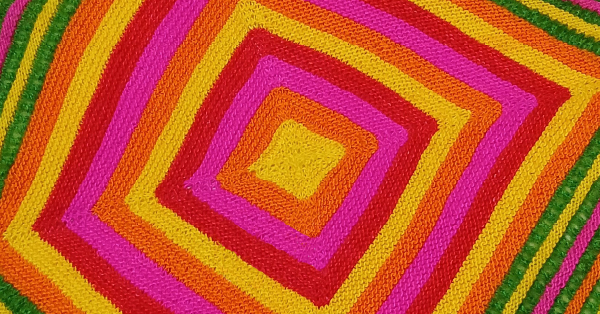 detail photograph of a knitted garment from a textiles exhibition