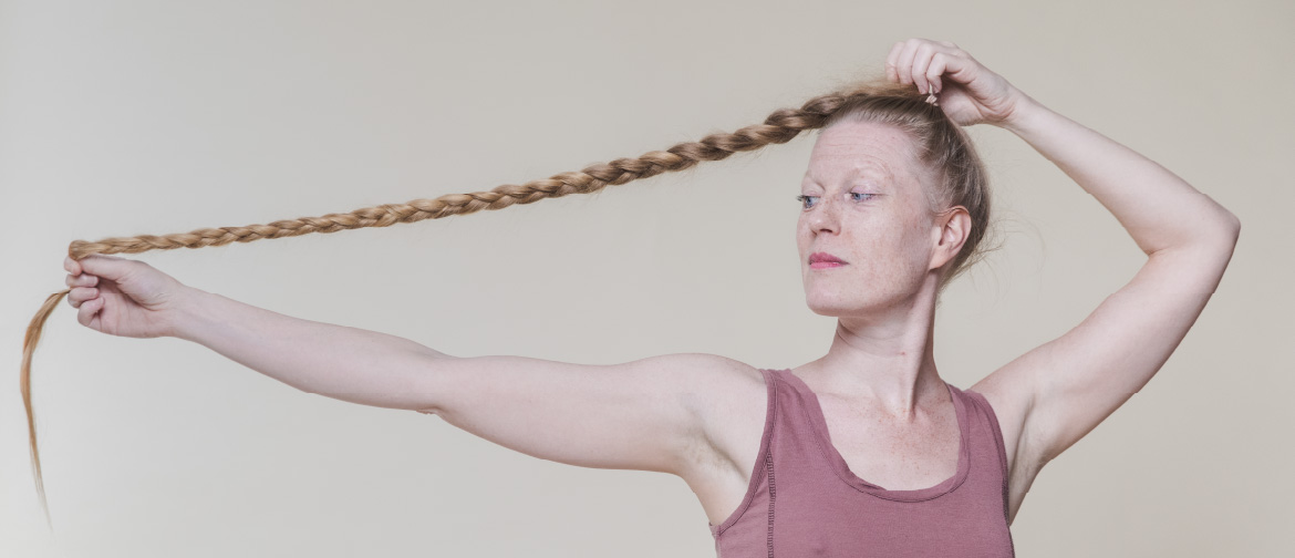 ortrait photo of nordic folk singing artist on a neutral background